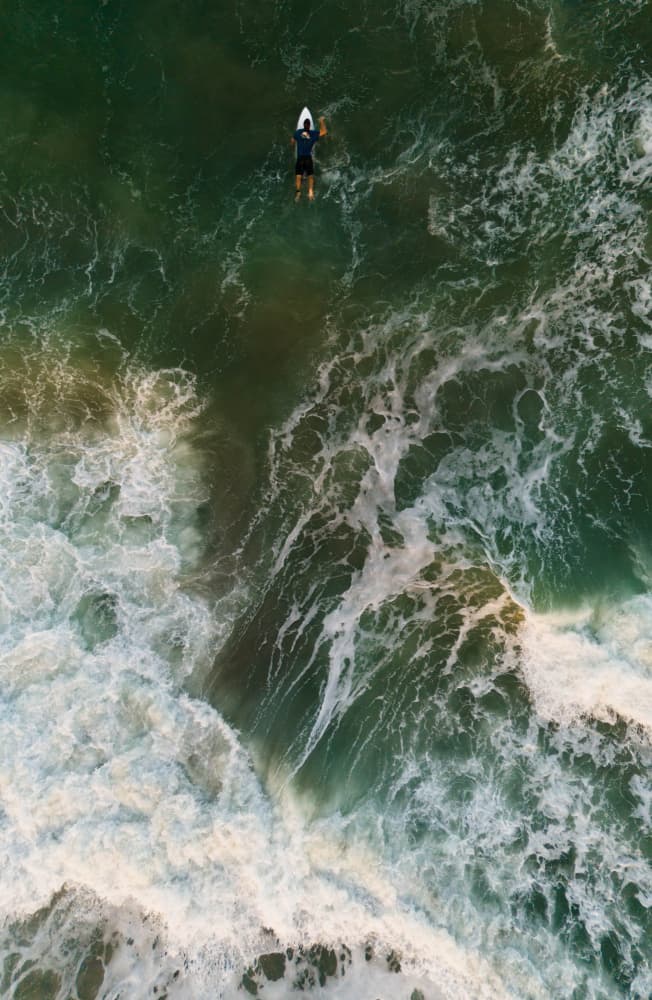 Lone Surfer Green Ocean by Md. Arifuzzaman — canvas wall art