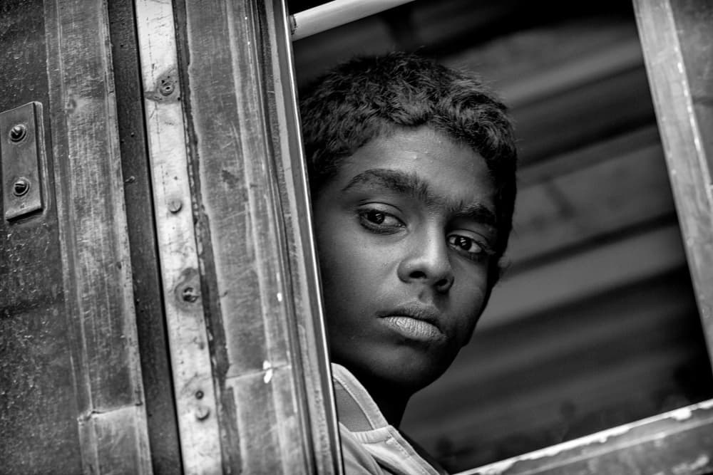 Thoughtful Child In Window by John Hoey — canvas wall art