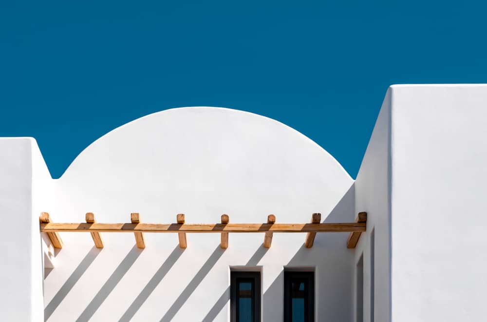 White Building Blue Sky by Markus Auerbach — canvas wall art