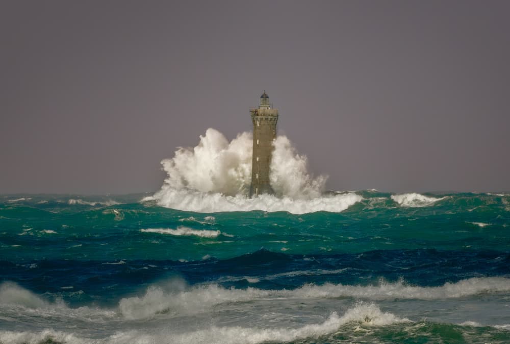Lighthouse In Turbulent Sea by Wim Denijs — canvas wall art