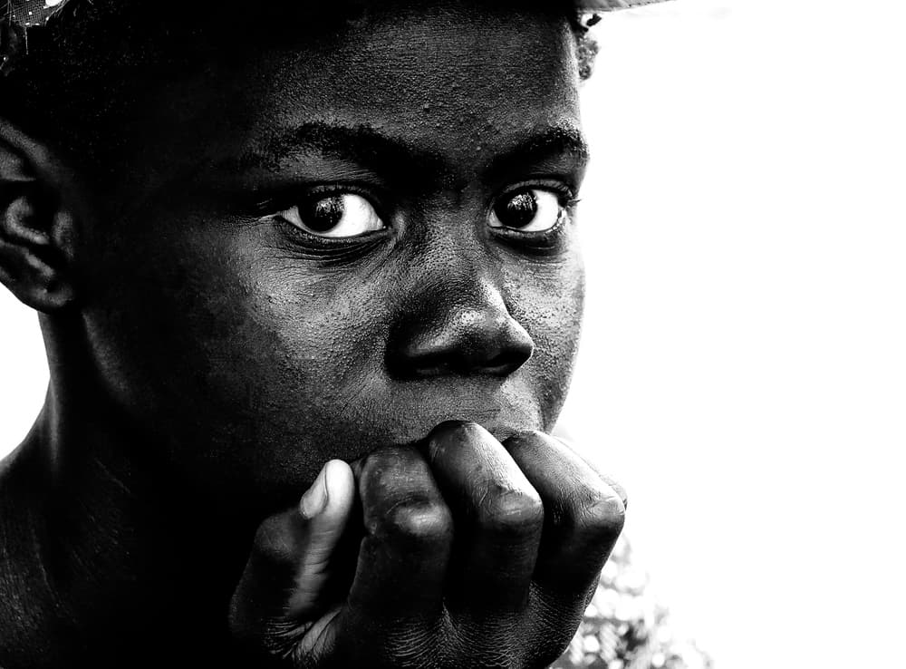 Pensive Young Boy by Elena Molina — canvas wall art