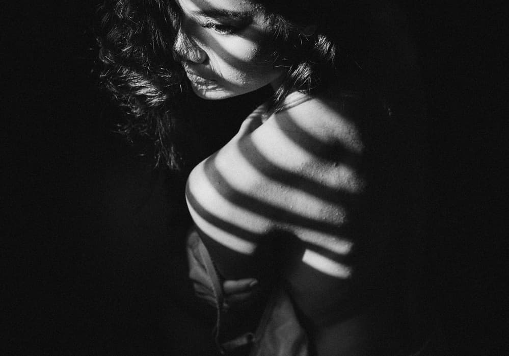 Thoughtful Woman In Light by ADIREK M — canvas wall art