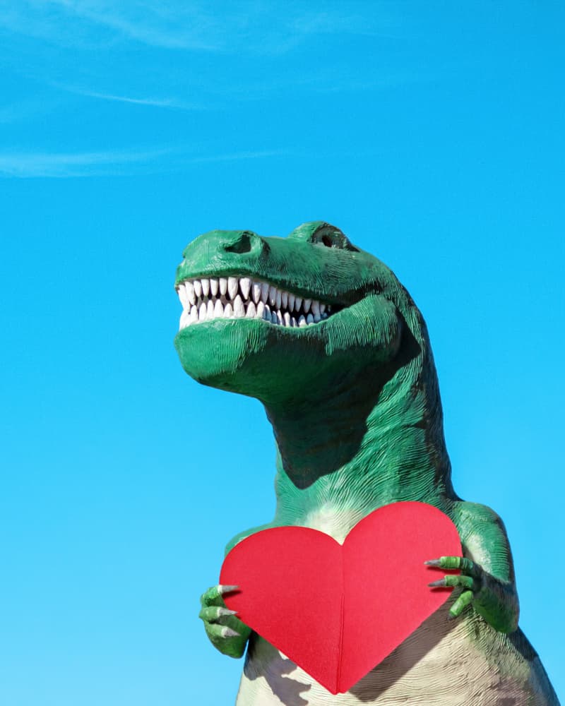 Tyrannosaurus Rex with a Red Paper Heart by Tom Windeknecht — canvas wall art