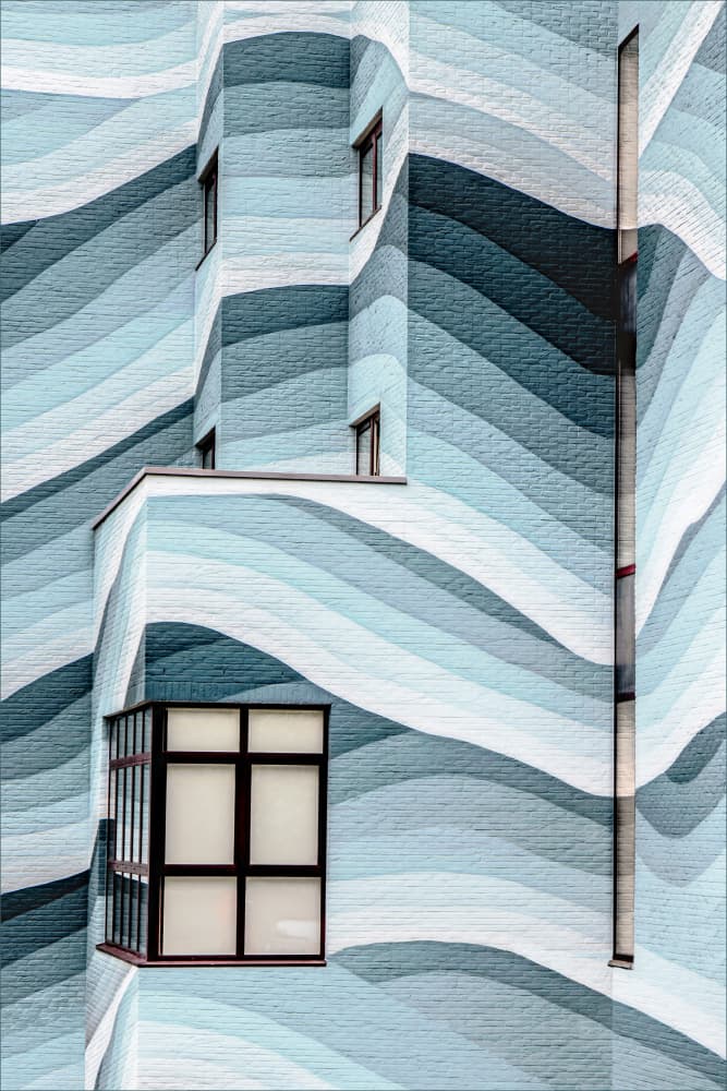 Rippling Blue Building by Gilbert Claes — canvas wall art