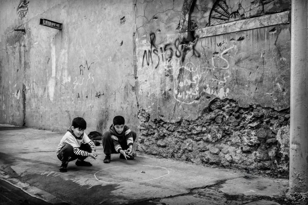 Boys Playing Marbles by Jalili — canvas wall art