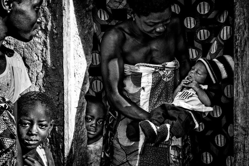 African Mother's Tender Gaze by Joxe Inazio Kuesta Garmendia — canvas wall art