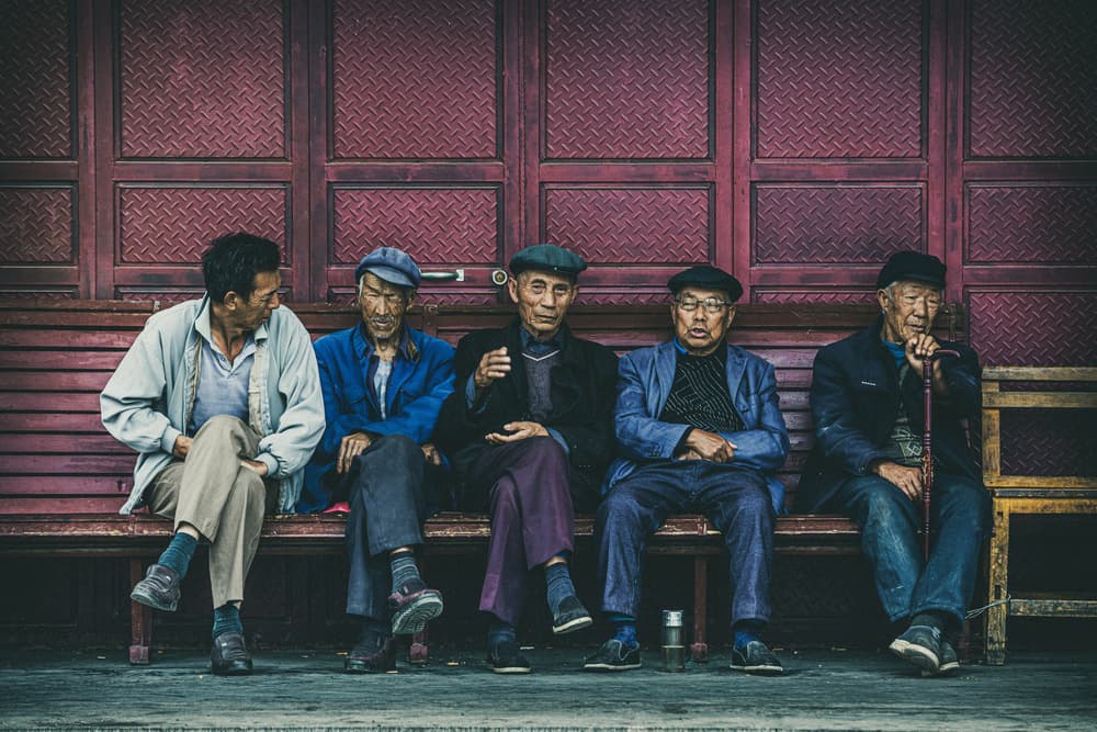 Elderly Men On Bench by Marco Tagliarino — canvas wall art