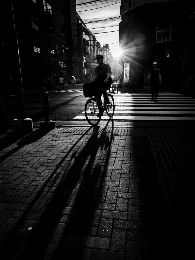 Sunlit City Cyclist by Kenichiro Tsukada — canvas wall art
