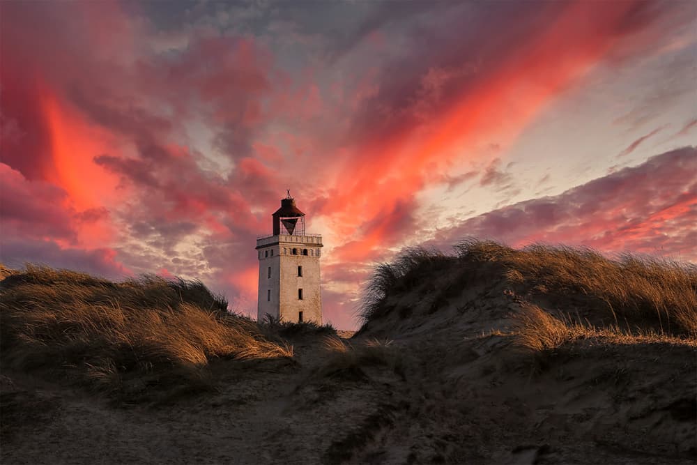 Lighthouse Under Red Sky by Leif Løndal — canvas wall art