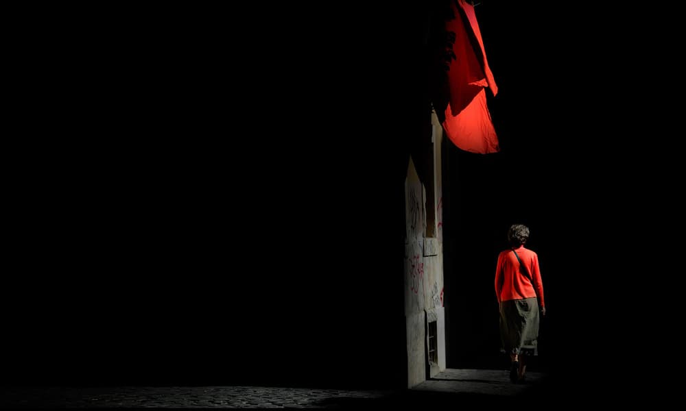 Woman Under Red Flag by Antonio Grambone — canvas wall art