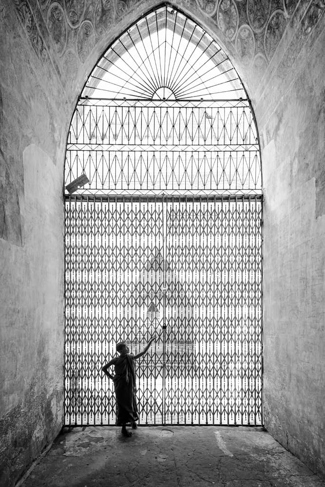 Monk At Ornate Gate by Gunarto Song — canvas wall art
