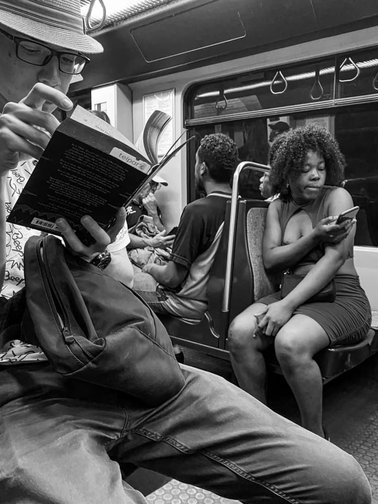 Reading on the Subway by Fernando Coelho — canvas wall art