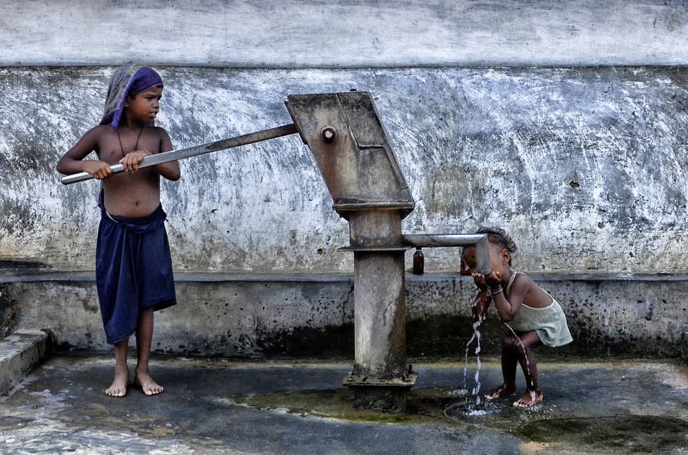 Children Fetching Water by Avishek Das — canvas wall art