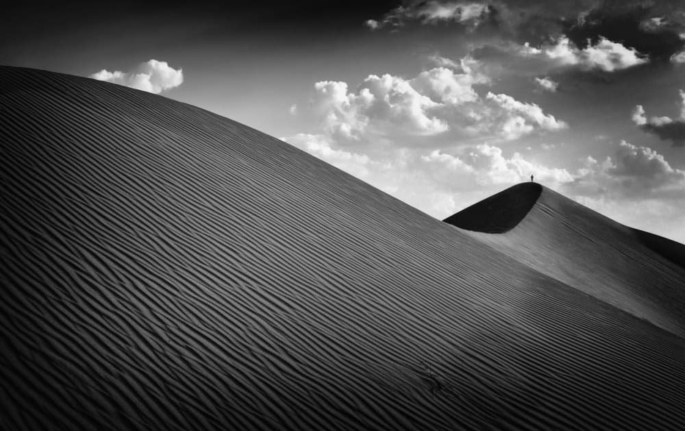 Lone Figure Desert Dunes by Izidor Gasperlin — canvas wall art