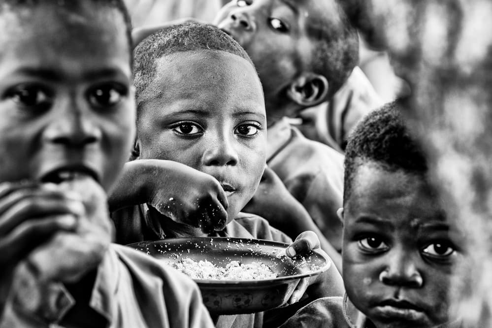 Young Boys Mealtime by Joxe Inazio Kuesta Garmendia — canvas wall art