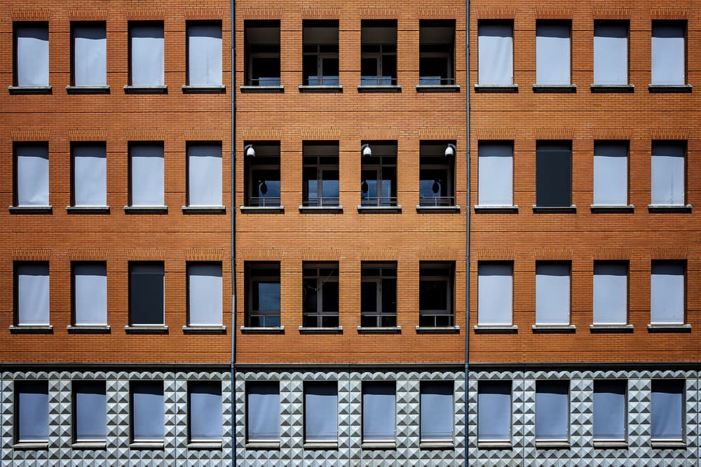 Geometric Brick Facade by Henk van Maastricht — canvas wall art