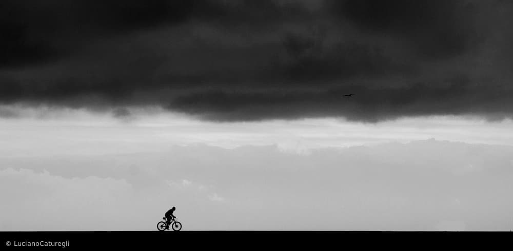 Solitary Ride Dark Sky by Luciano Caturegli — canvas wall art