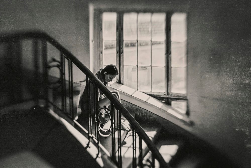 Pensive Woman Staircase by Bogdan Bouşcă — canvas wall art