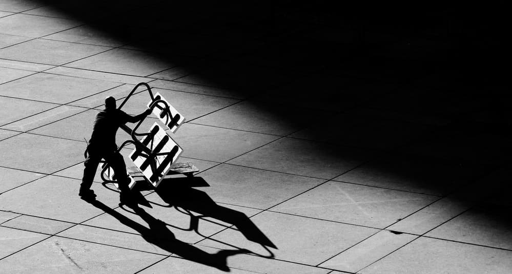 Urban Figure and Shadows by Jian Wang — canvas wall art