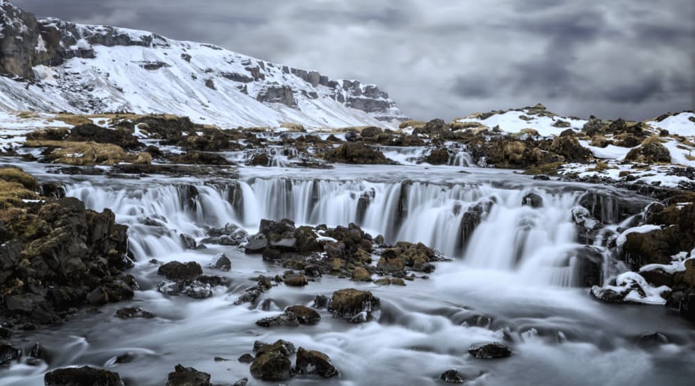 Snowy Mountain Waterfall by Angéla Vicedomini — canvas wall art