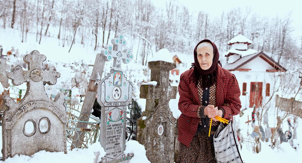 Elderly Woman Snowy Graves by Julien Oncete — canvas wall art