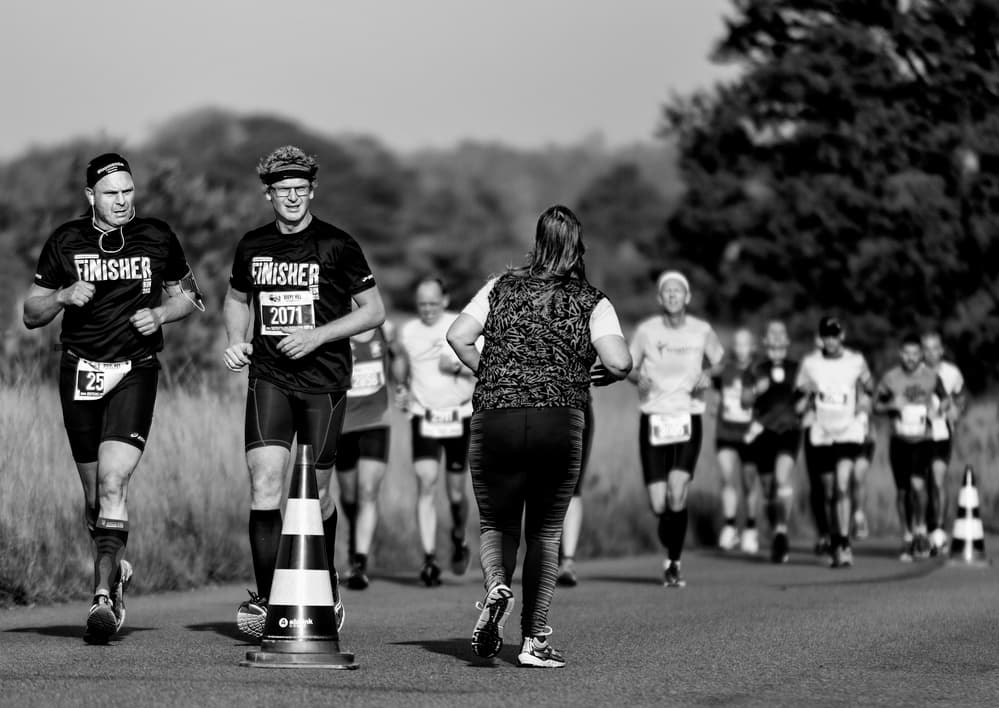 Black White Marathon Runners by Gerard Jonkman — canvas wall art