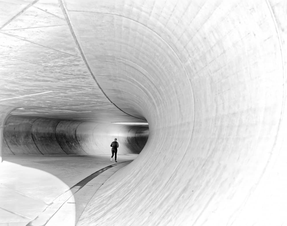 Runner in Curved Tunnel by Andreas Timar — canvas wall art