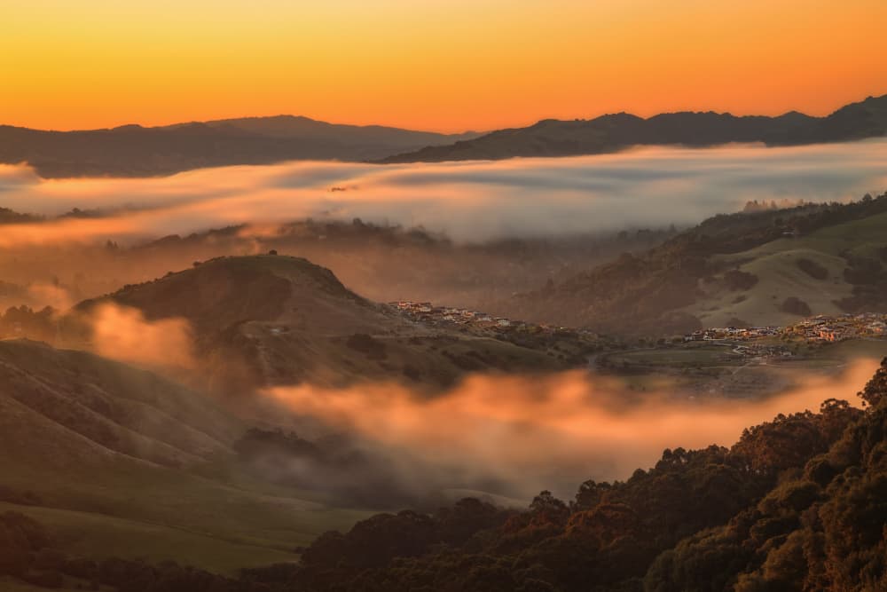 Misty Mountain Sunrise by Jenny Qiu — canvas wall art