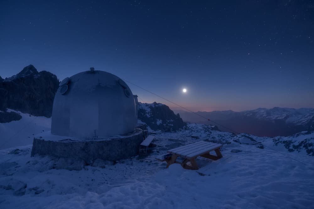 Moonlit Alpine Hut by Carlos Gonzalez — canvas wall art