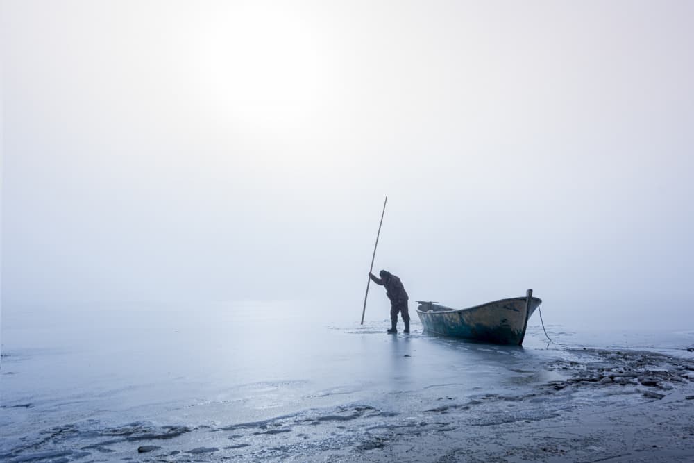 Misty Winter Boatman by Ali Can — canvas wall art