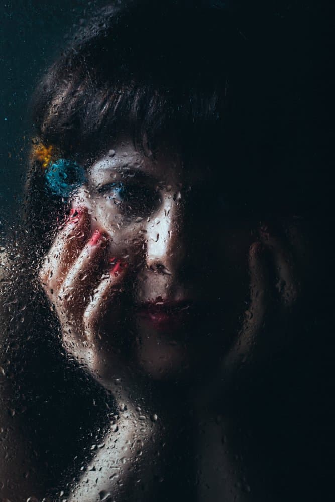 Pensive Woman Behind Glass by M. Emre Erol — canvas wall art
