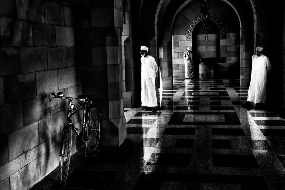 Arched Hallway Figures Bicycle by Giovanni Cavalli — canvas wall art