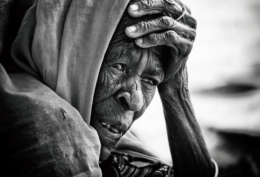 Pensive Elderly Woman by Elena Molina — canvas wall art