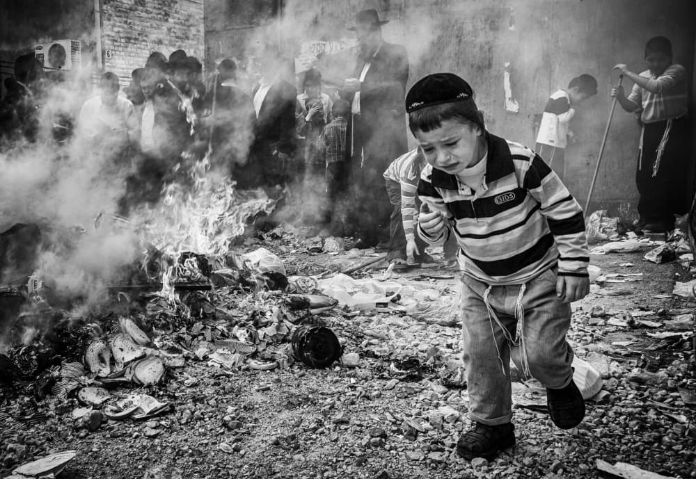 Crying Boy Amidst Smoke by Tomer Eliash — canvas wall art