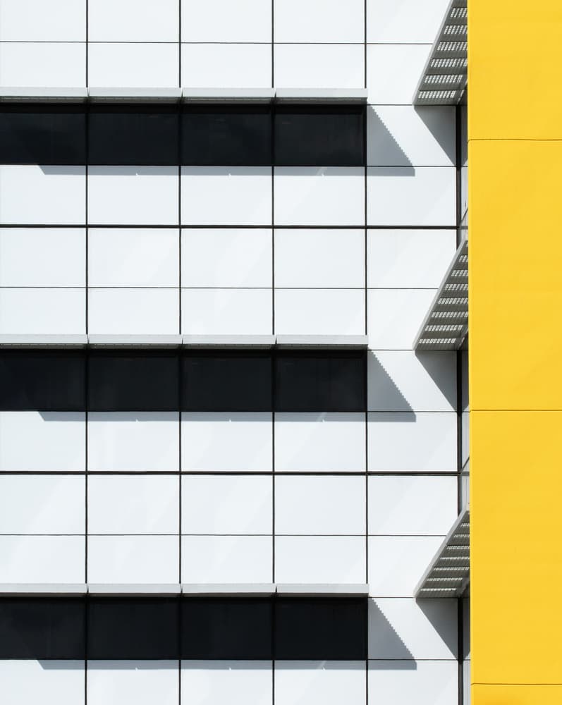 Geometric Yellow Facade by Jacqueline Hammer — canvas wall art