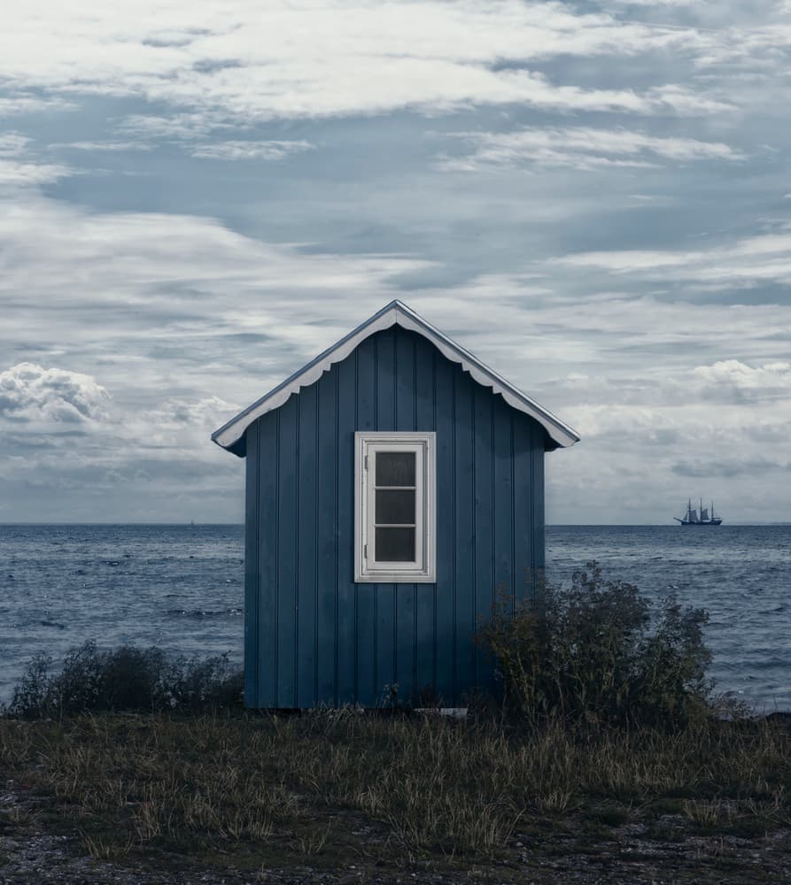 Blue Coastal Cabin by Lotte Grønkjær — canvas wall art