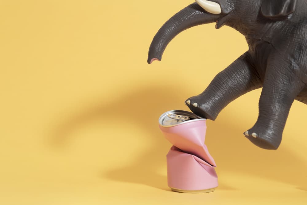 Toy Elephant Crushes Can by Julia Ramiro — canvas wall art