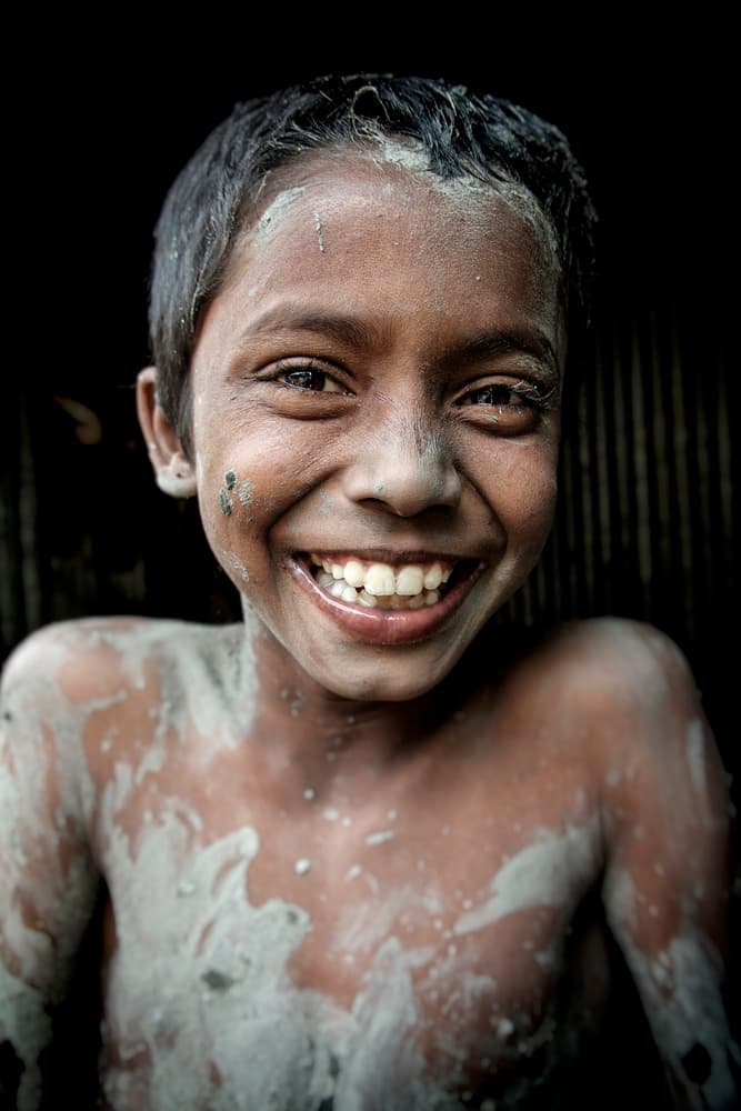 Smiling Muddy Boy by Elena Molina — canvas wall art