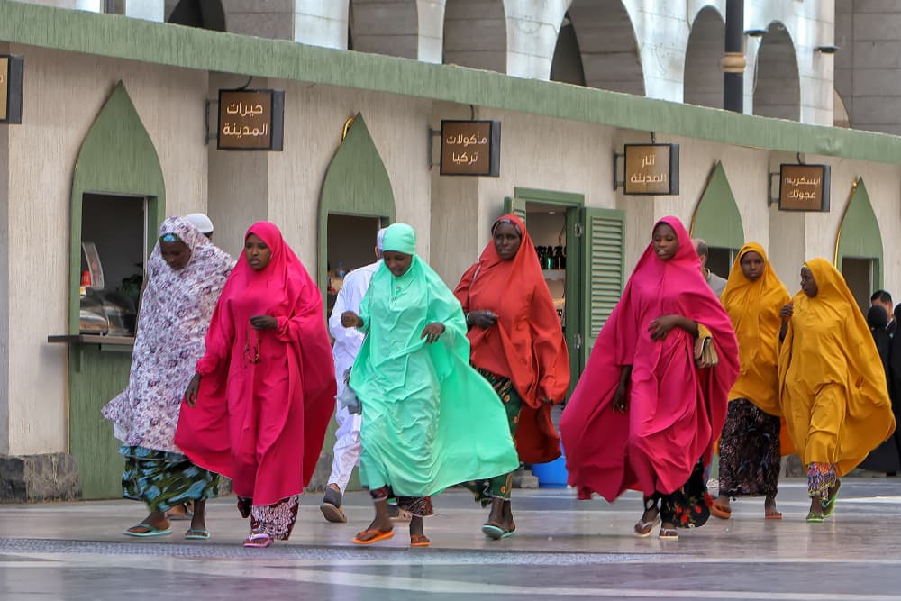 Women in Colorful Robes by Fauzan Maududdin — canvas wall art