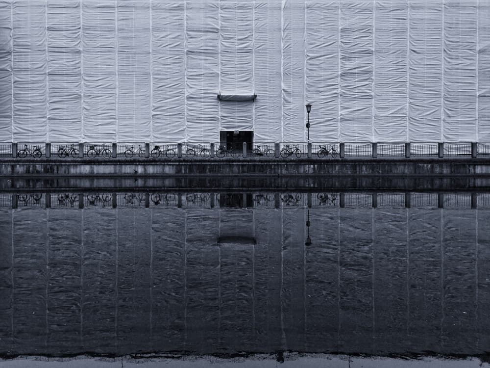 Monochrome City Reflection by Philippe-M — canvas wall art