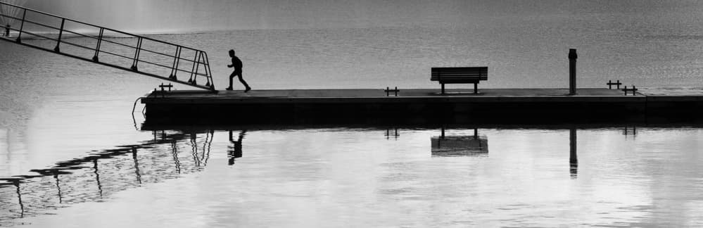 Runner On Dock Reflection by Julien Oncete — canvas wall art