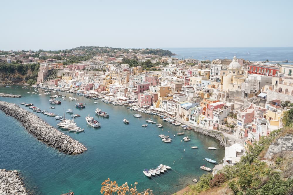 Colorful Procida Harbor by Henrike Schenk — canvas wall art