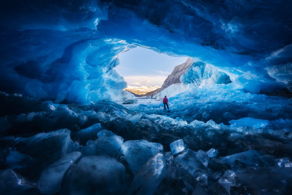 Blue Ice Cave Adventure by Junbo Liang — canvas wall art