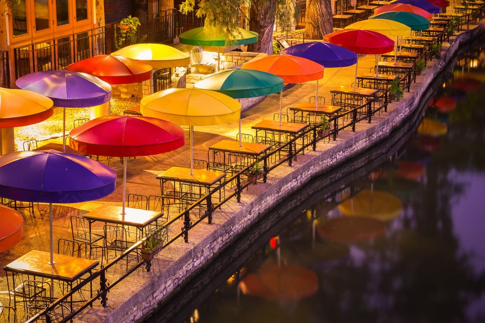 Colorful Riverside Umbrellas by Michael Zheng — canvas wall art