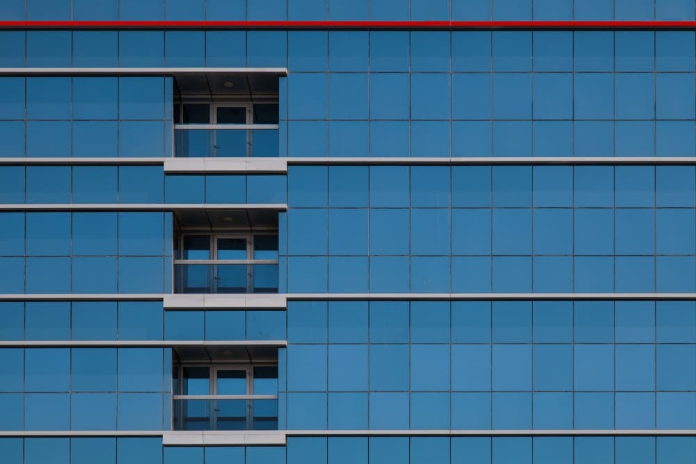 Sleek Blue Glass Facade by Harry Verschelden — canvas wall art