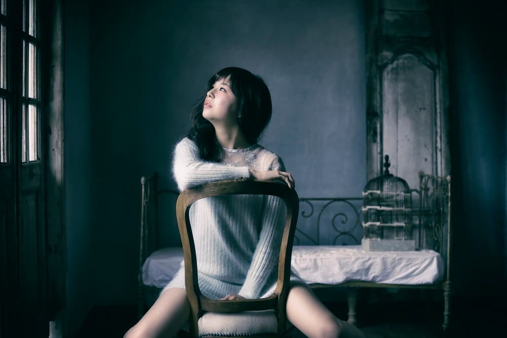 Pensive Woman Looking Up by 7 Flavor C/P — canvas wall art