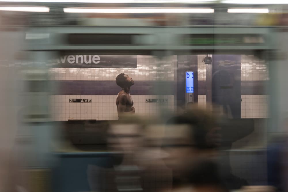 Subway Man Looking Up by Rob Li — canvas wall art