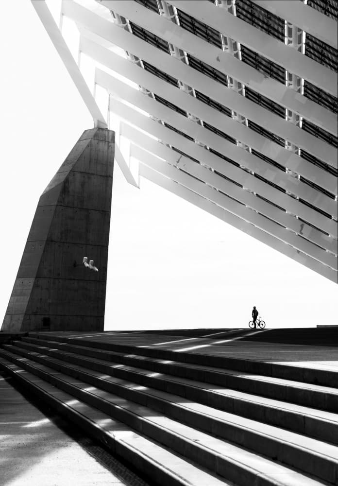 Lone Cyclist Architecture by Anna Niemiec — canvas wall art