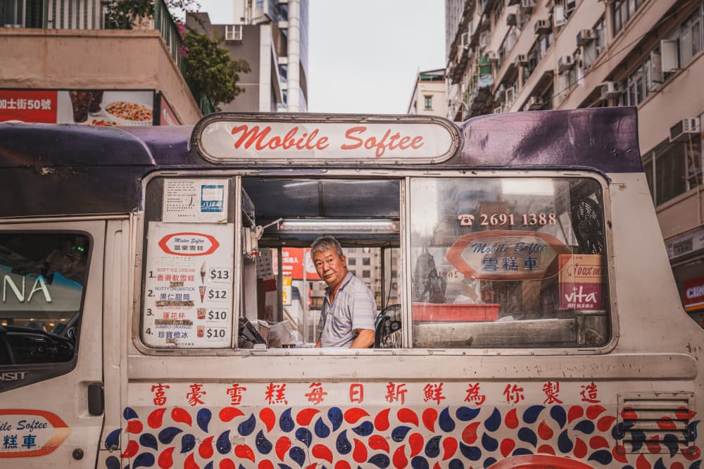Smiling Hong Kong Vendor by Alan Kwang — canvas wall art