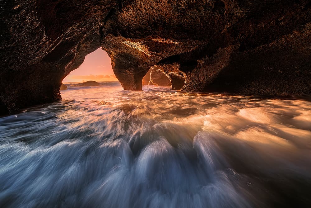 Golden Sea Cave Waves by Jingshu Zhu — canvas wall art
